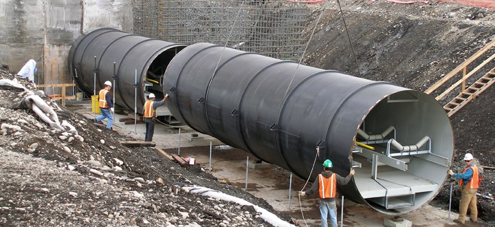 Crew installing pipe for a stacker/reclaimer project for Weyerhaeuser.