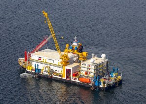 Aerial shot of the Arctic Containment System in the water during trials by Greenberry.