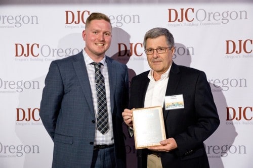 Greg Toy accepts DJC award
